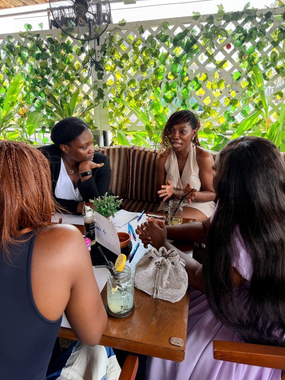 Four women in conversation at a Kumu Circle event in Lagos